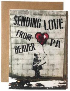 Banksy-style street art post card sold by BeaverTown gift shop, Beaver, Pa.