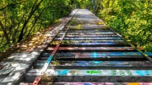Graffiti Bridge, also known as the Art Bridge, is an abandoned train trestle located near Harrison St. in Rochester Township. (Photos: Joel B., June 2017)